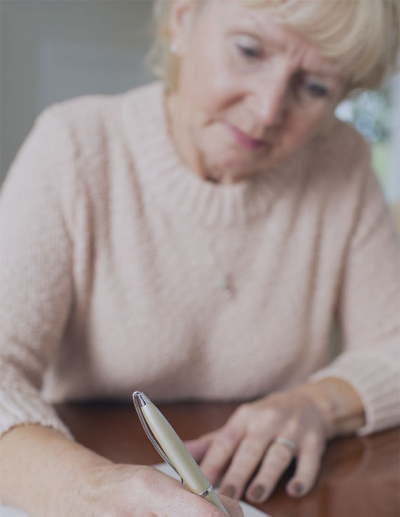 Woman signing her will